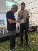 Mark Noble giving snails tails membership after their talk